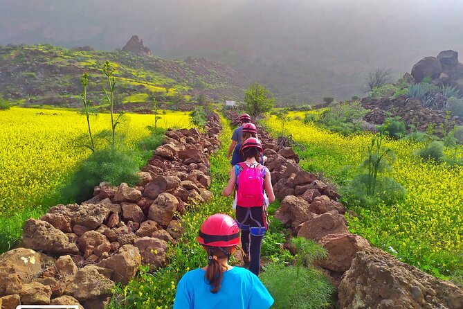 Climbing + Zipline + Via Ferrata + Cave. Adventure route in Gran Canaria - Volcanic tube cave and speleology: cool air, tight spaces, head-torch crawling