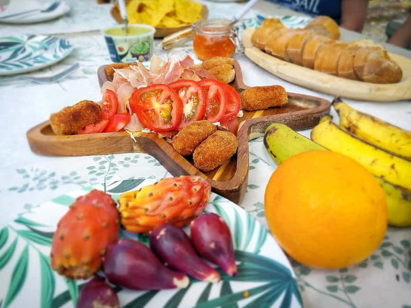 Gran Canaria: Red Gorge, Cave, Oasis Adventure Tour & Picnic - The Canarian tapas picnic: local flavors, fruit tasting, and a chilled drink