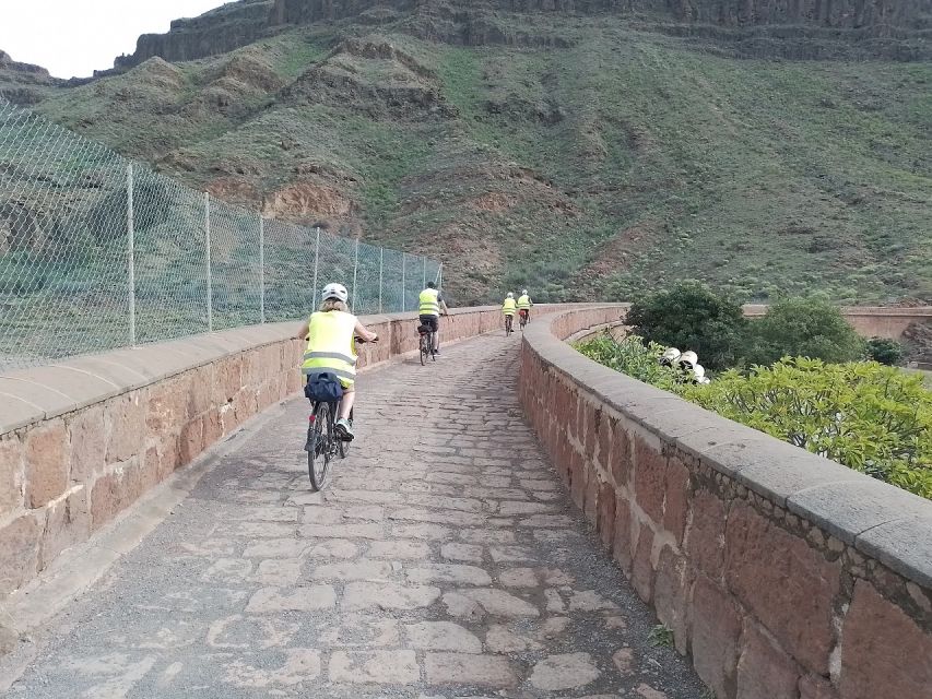 Maspalomas: Ayagaures E-Bike Mountain Tour Optional Tapas - Ayagaures Dam bridge views and the “downhill means fun” return